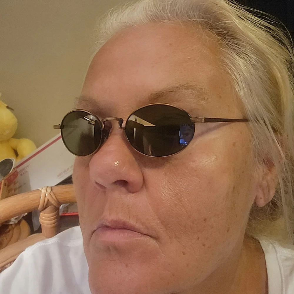 Revo Oval Copper Frame Sunglasses with Dark Gray Lenses